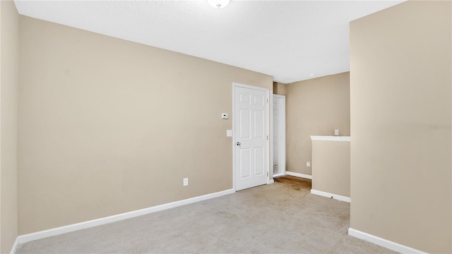 1336 Chelsea Dr, Davenport, FL 33897 - carpeted empty room with baseboards