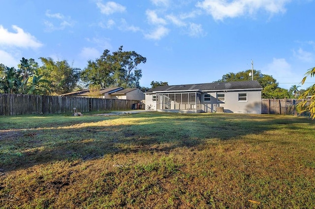 view of yard featuring a sunroom