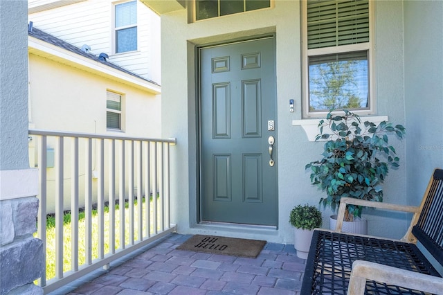 entrance to property featuring covered porch