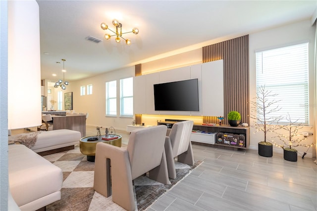 living room featuring an inviting chandelier