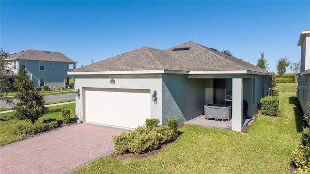 view of property exterior with a yard and a garage