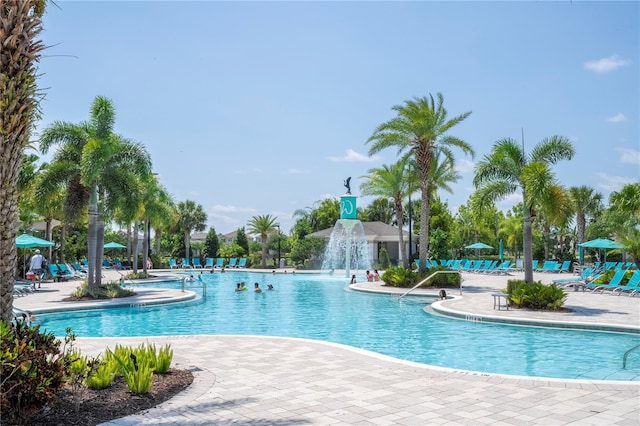 view of swimming pool featuring pool water feature