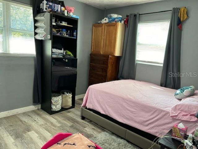 bedroom with light hardwood / wood-style floors