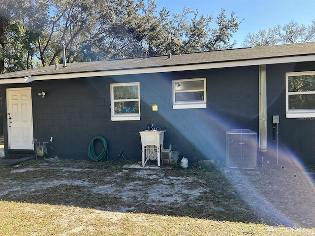 exterior space featuring cooling unit and sink