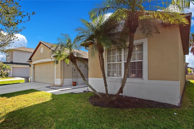 view of front of property featuring a garage and a front lawn