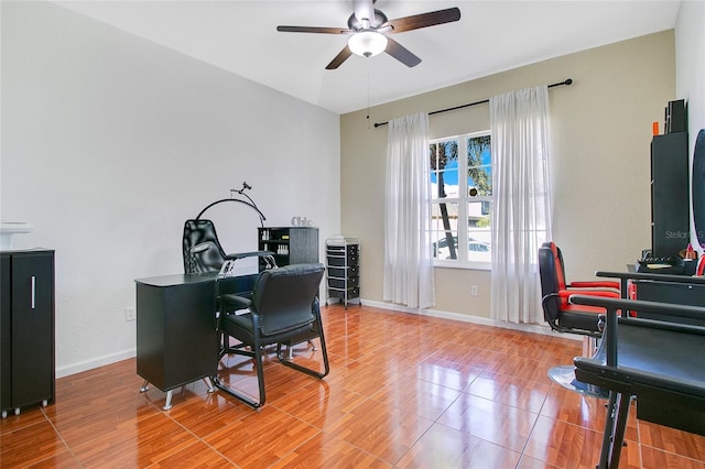 home office with hardwood / wood-style flooring and ceiling fan