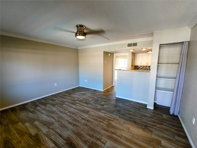 unfurnished living room with a textured ceiling, dark hardwood / wood-style floors, ceiling fan, and ornamental molding