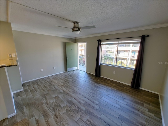 unfurnished room featuring ceiling fan, light hardwood / wood-style floors, ornamental molding, and a textured ceiling