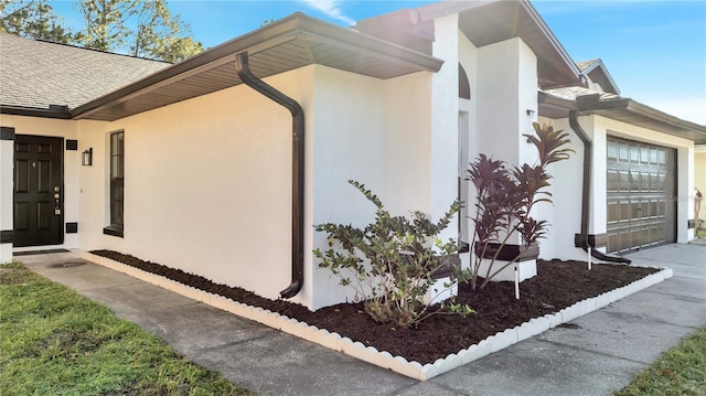 view of side of property featuring a garage