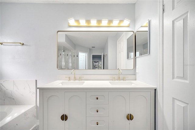 bathroom with vanity and a tub to relax in