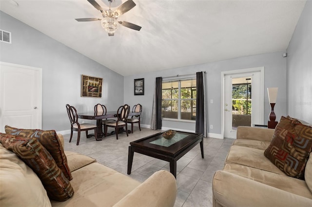 tiled living room featuring ceiling fan and lofted ceiling