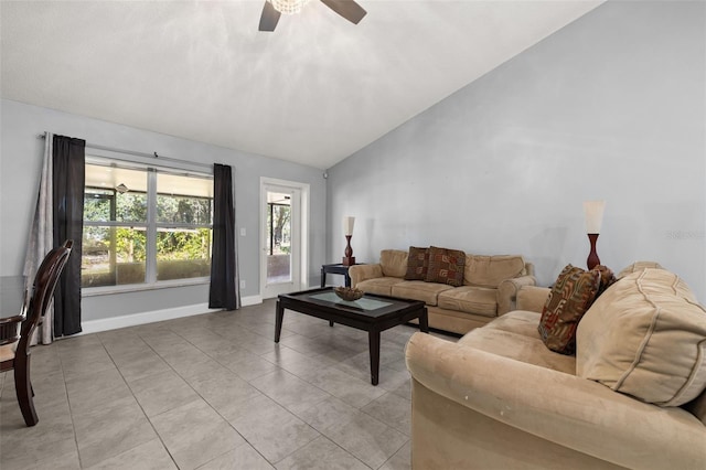 tiled living room featuring ceiling fan and lofted ceiling