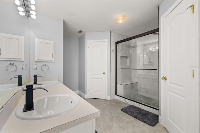 bathroom featuring vanity and a shower with shower door