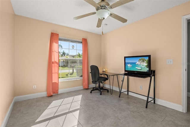 office featuring ceiling fan and a textured ceiling