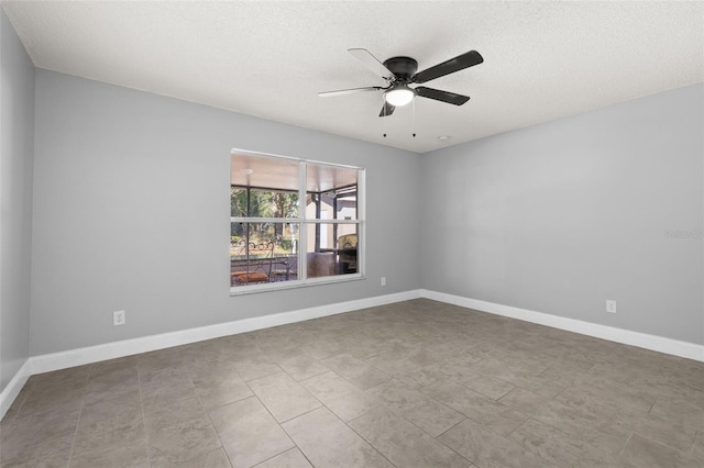 unfurnished room featuring light tile patterned floors, a textured ceiling, and ceiling fan