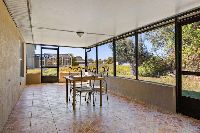 unfurnished sunroom featuring a healthy amount of sunlight