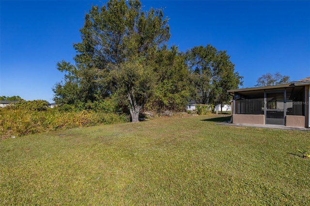 view of yard featuring a sunroom