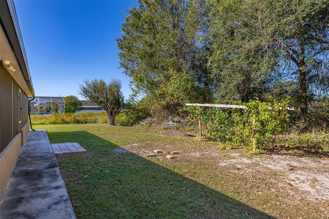 view of yard featuring a lanai