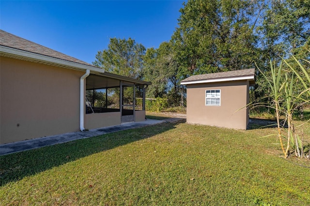 view of yard with a sunroom