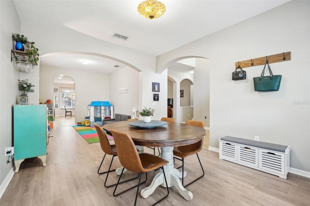 dining area with light hardwood / wood-style flooring