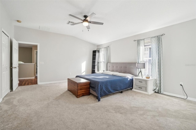 carpeted bedroom featuring vaulted ceiling and ceiling fan