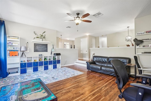 living room with hardwood / wood-style floors and ceiling fan