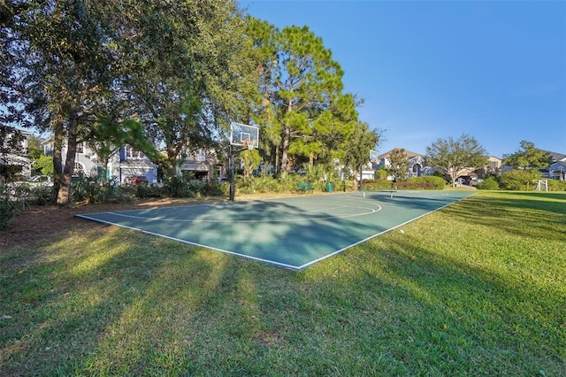 view of basketball court featuring a lawn