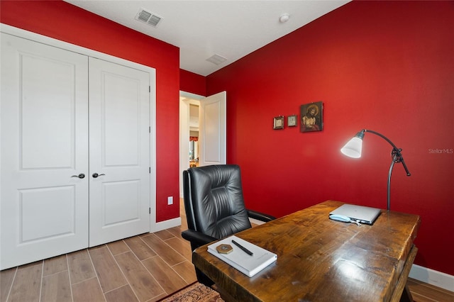 office with hardwood / wood-style flooring