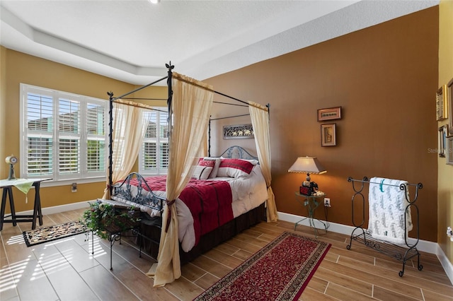 bedroom with wood-type flooring