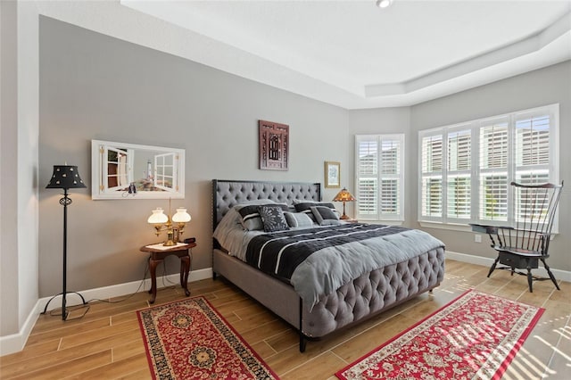 bedroom with hardwood / wood-style flooring