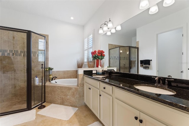 bathroom with tile patterned floors, vanity, and separate shower and tub