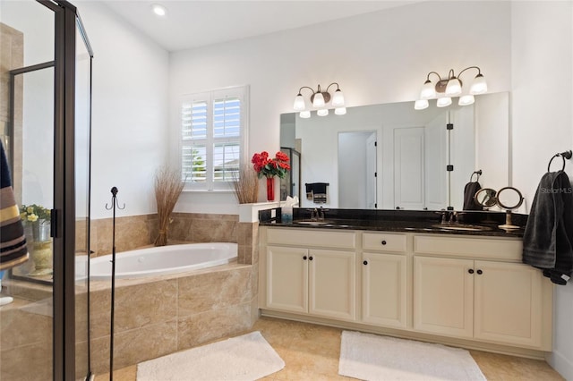 bathroom with plus walk in shower, tile patterned flooring, and vanity