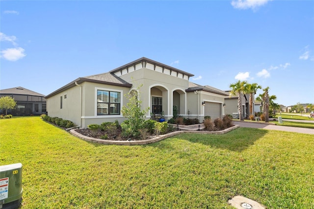 view of front of property with a front yard and a garage