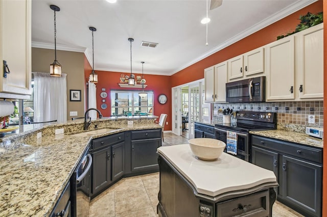 kitchen with white cabinets, sink, ornamental molding, appliances with stainless steel finishes, and decorative light fixtures