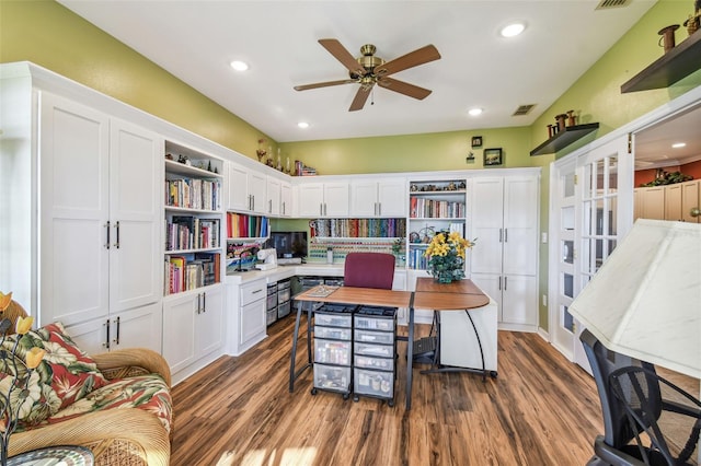 office with ceiling fan and dark wood-type flooring