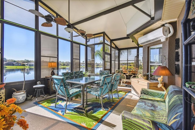 sunroom with a water view, a wall unit AC, and lofted ceiling