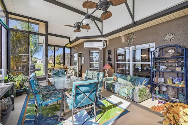 sunroom / solarium with lofted ceiling with beams, a healthy amount of sunlight, a wall unit AC, and ceiling fan