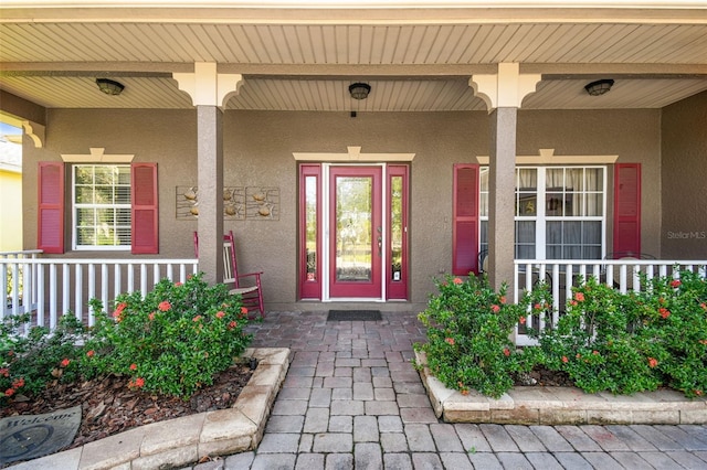 doorway to property with a porch