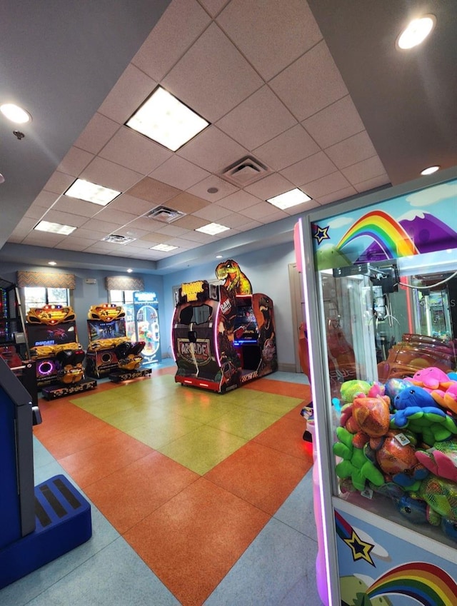 recreation room with a drop ceiling