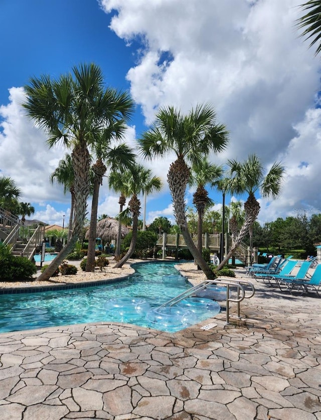 view of swimming pool with a patio