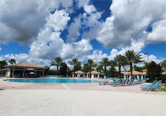 view of swimming pool featuring a patio area