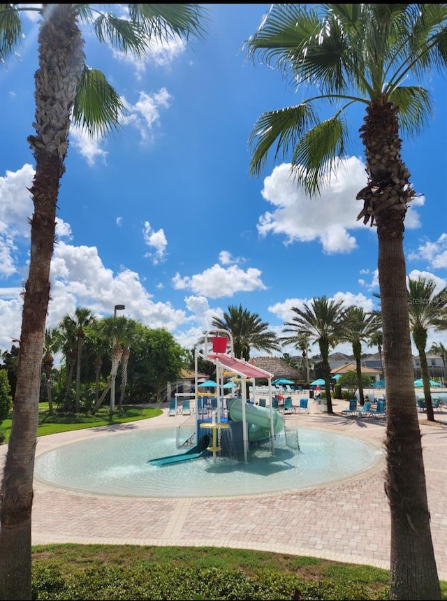 view of pool featuring a playground