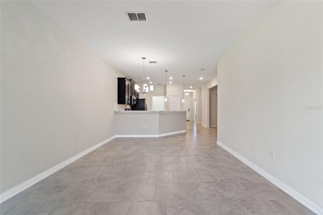 unfurnished living room with light tile patterned flooring