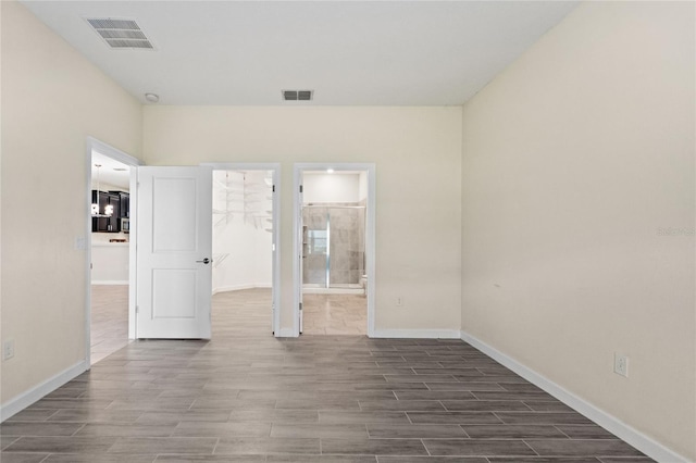 empty room with dark hardwood / wood-style floors