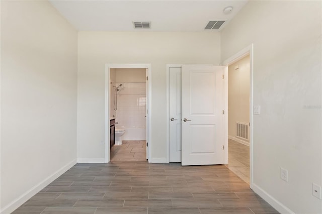 interior space featuring ensuite bath