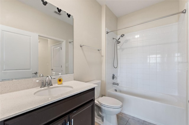 full bathroom featuring tile patterned flooring, vanity, toilet, and tiled shower / bath