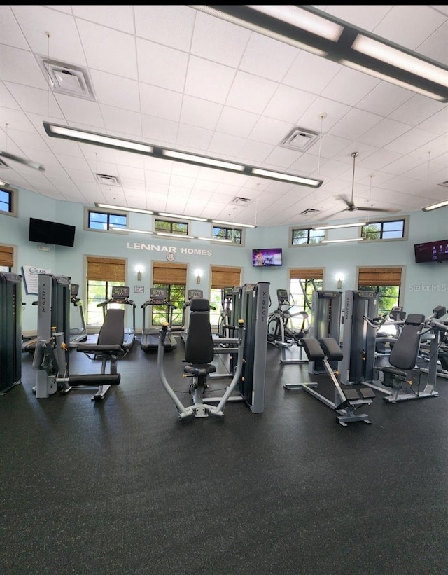 workout area with a towering ceiling