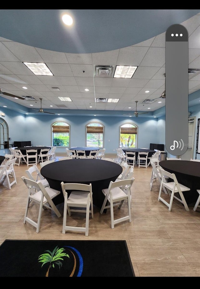 dining room with a drop ceiling