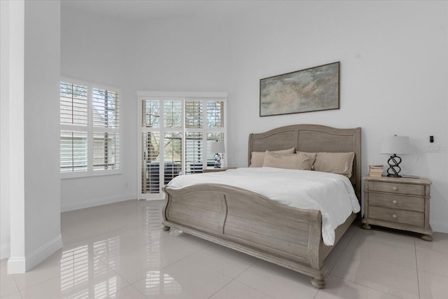 bedroom featuring light tile patterned flooring