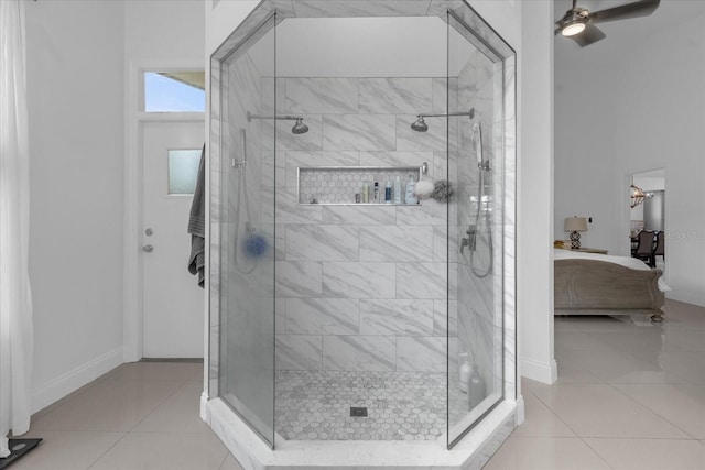 bathroom featuring tile patterned floors, ceiling fan, and a tile shower